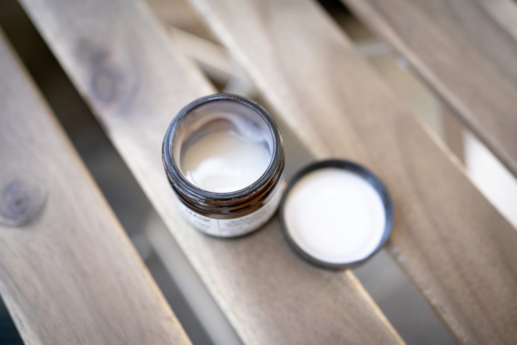 Jar of retinol skin cream relating to the benefits of retinoids for skin cancer.